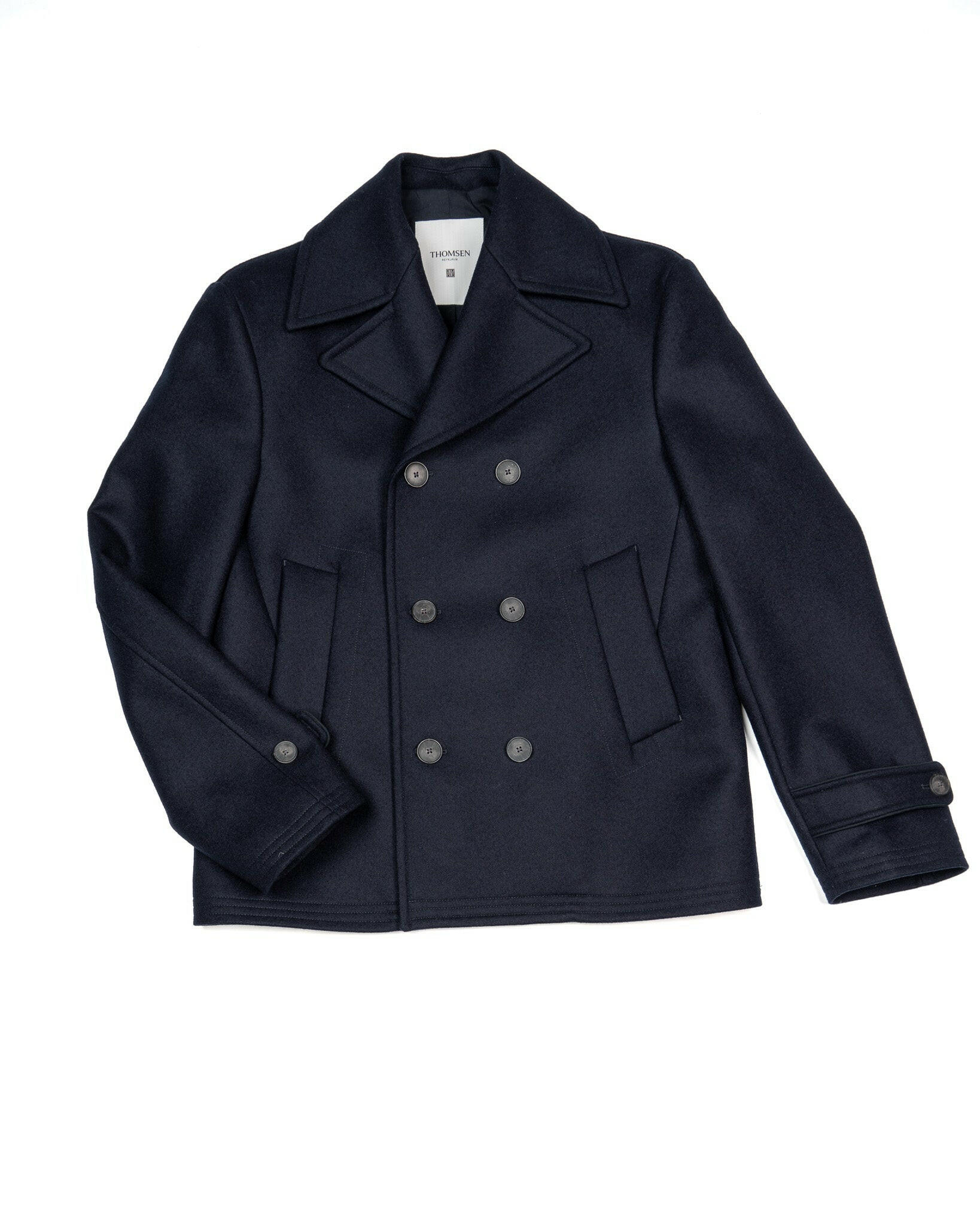 Vörumynd af bláum sjóarajakka, peacoat. Stuttur og tvíhnepptur með stórum kraga.